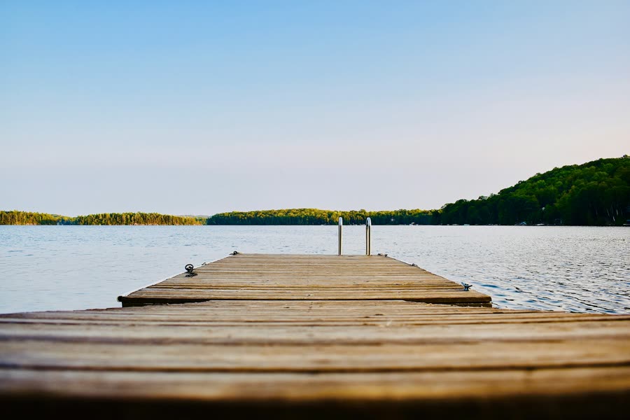 A wooden dock on a calm lake
