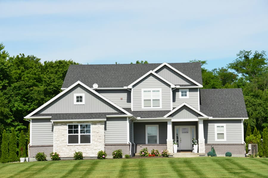 A neighborhood home with a green lawn