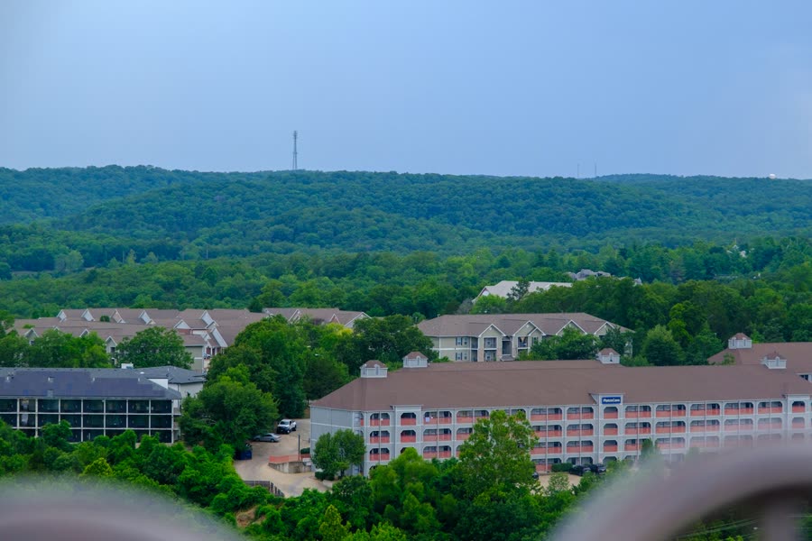 Homes and buildings among wooded hills